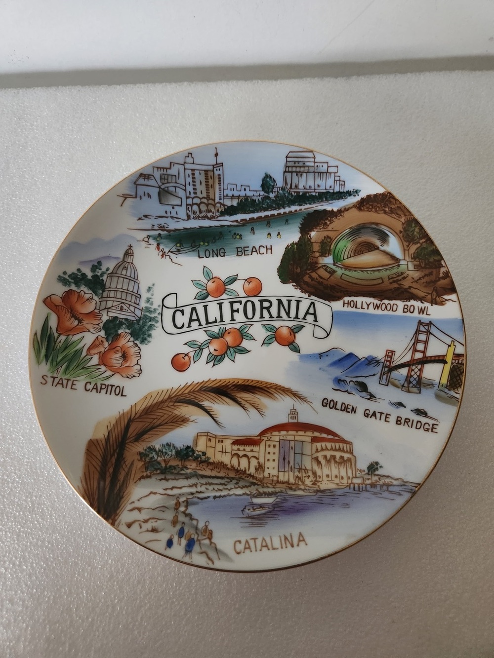 vintage Japan-made ceramic souvenir plate featuring scenes from California